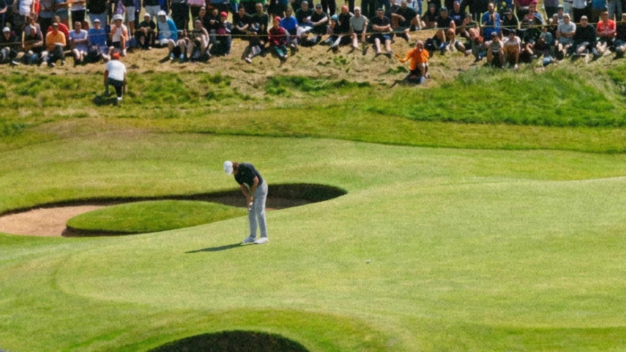 A golfer over the ball before the swing
